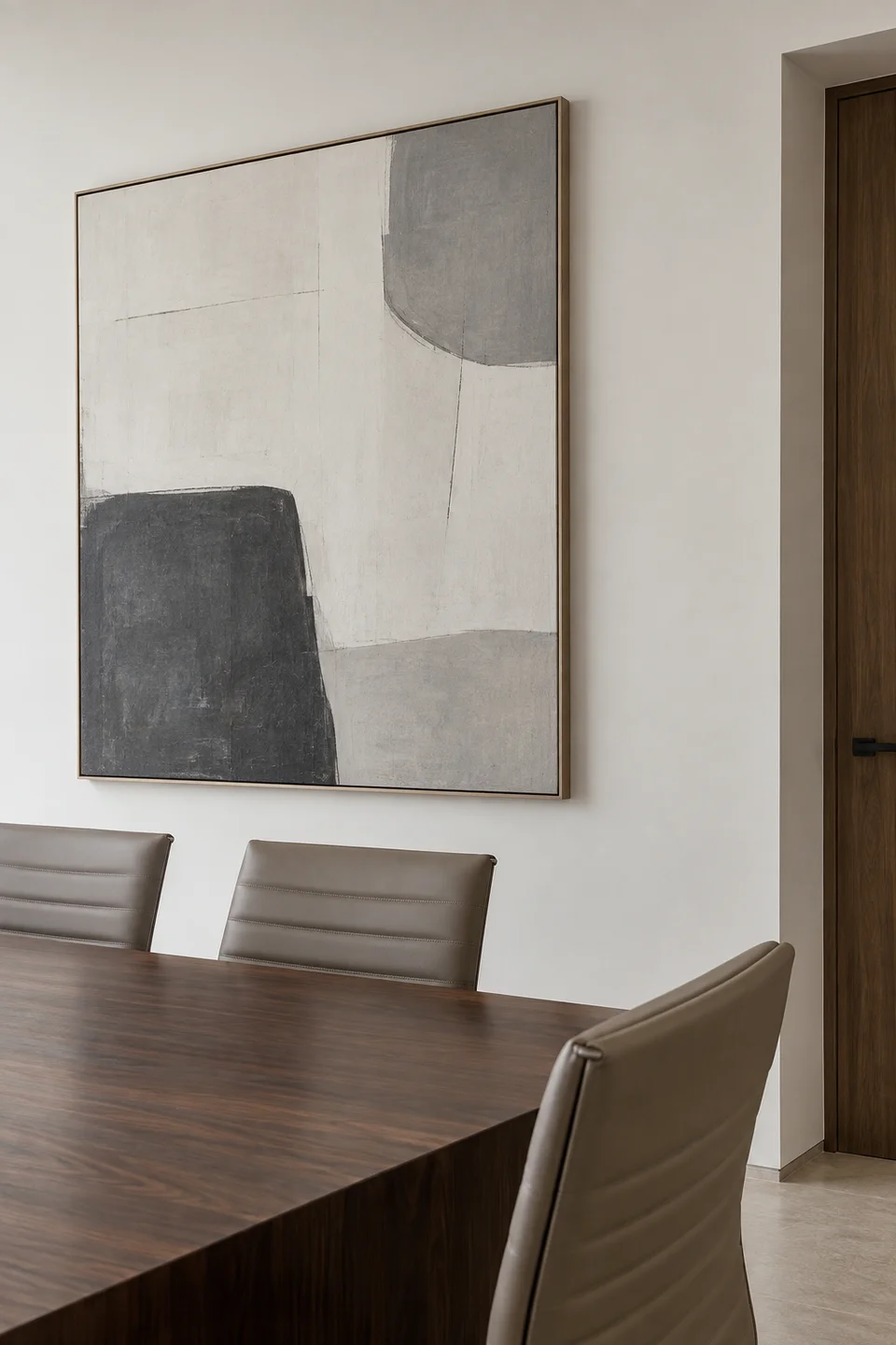 A legal meeting room with a walnut table and a large abstract painting